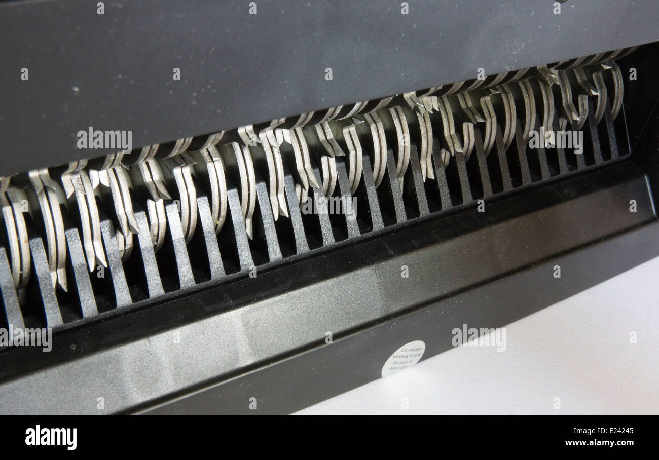 The teeth of a domestic paper shredder, used to prevent identity theft