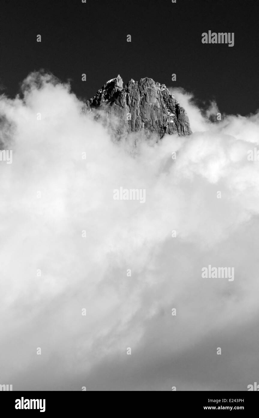 A mountain top and clouds - the Aiguille de Dru in Chamonix, France Stock Photo