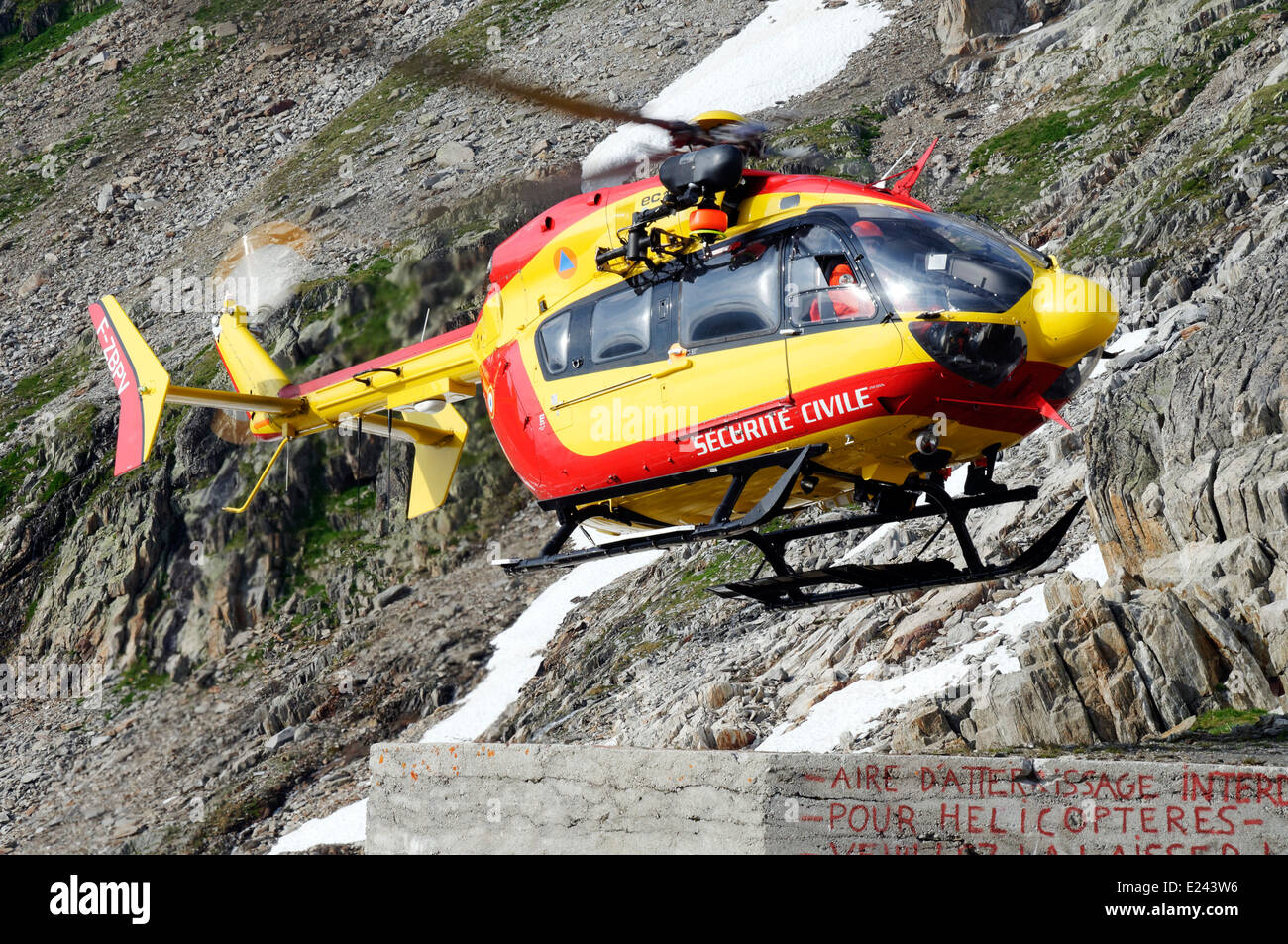 A french emergency mountain rescue helicopter at the Albert Premier hut in the French Alps Stock Photo