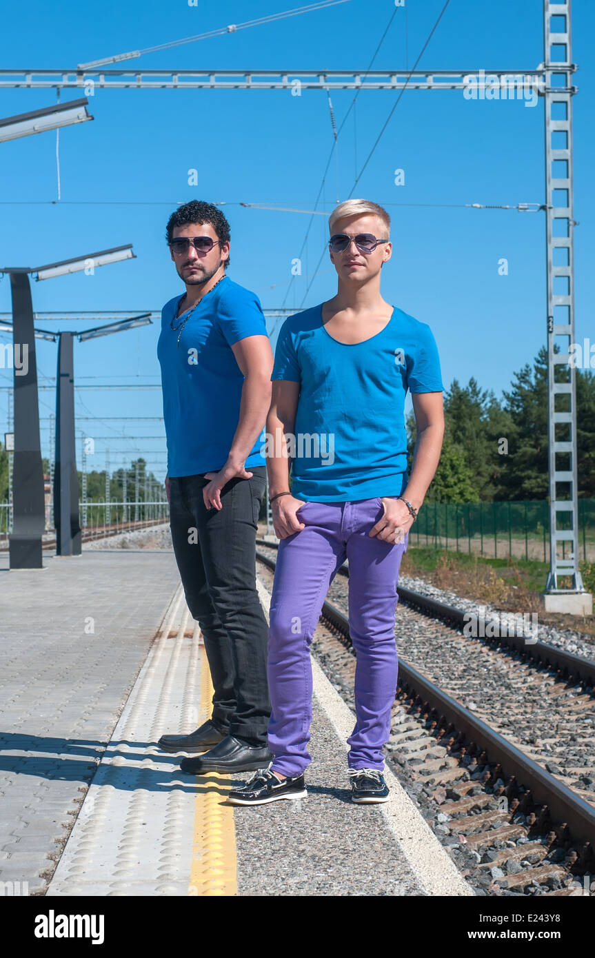 Two young men standing on the platform Stock Photo - Alamy