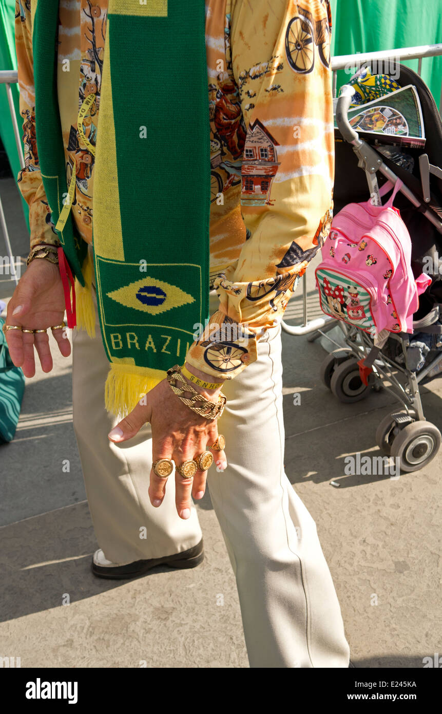 A man with sovereign rings on every finger and a Brazil football scarf at the Brazil Day festivities in Trafalgar Square. Stock Photo