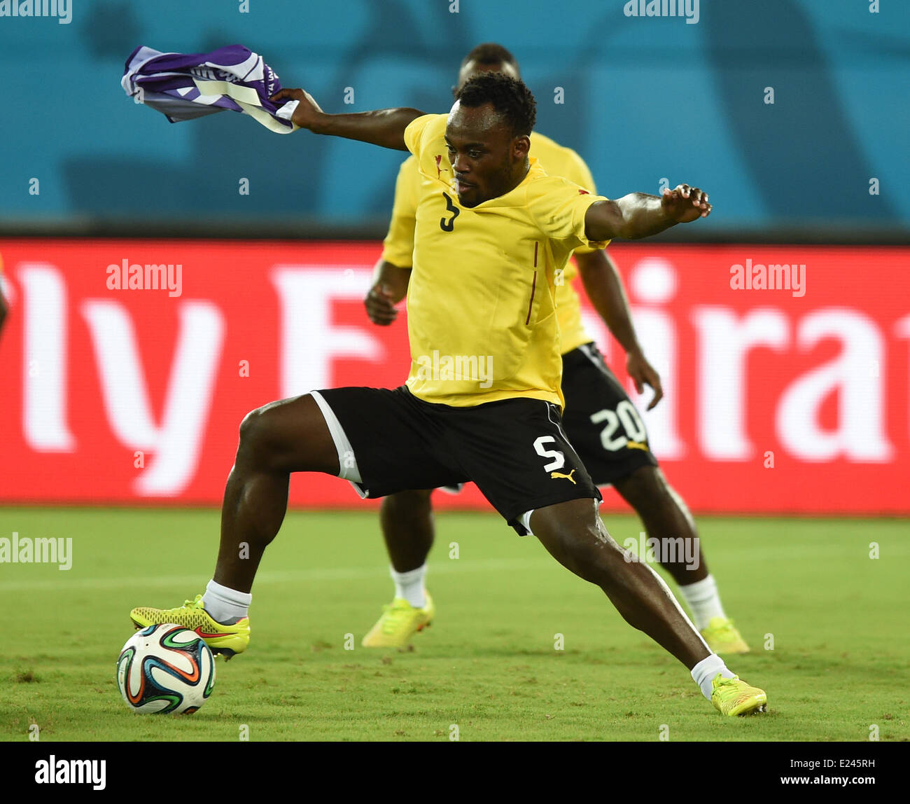 Natal, Brazil. 15th June, 2014. Michael Essien (L) in action during a training session of Ghana's national soccer team at the Arena das Dunas Stadium in Natal, Brazil, 15 June 2014. Ghana will face USA in their group G preliminary round match at the FIFA World Cup 2014 on 16 June 2014 in Natal. Photo: Marius Becker/dpa/Alamy Live News Stock Photo