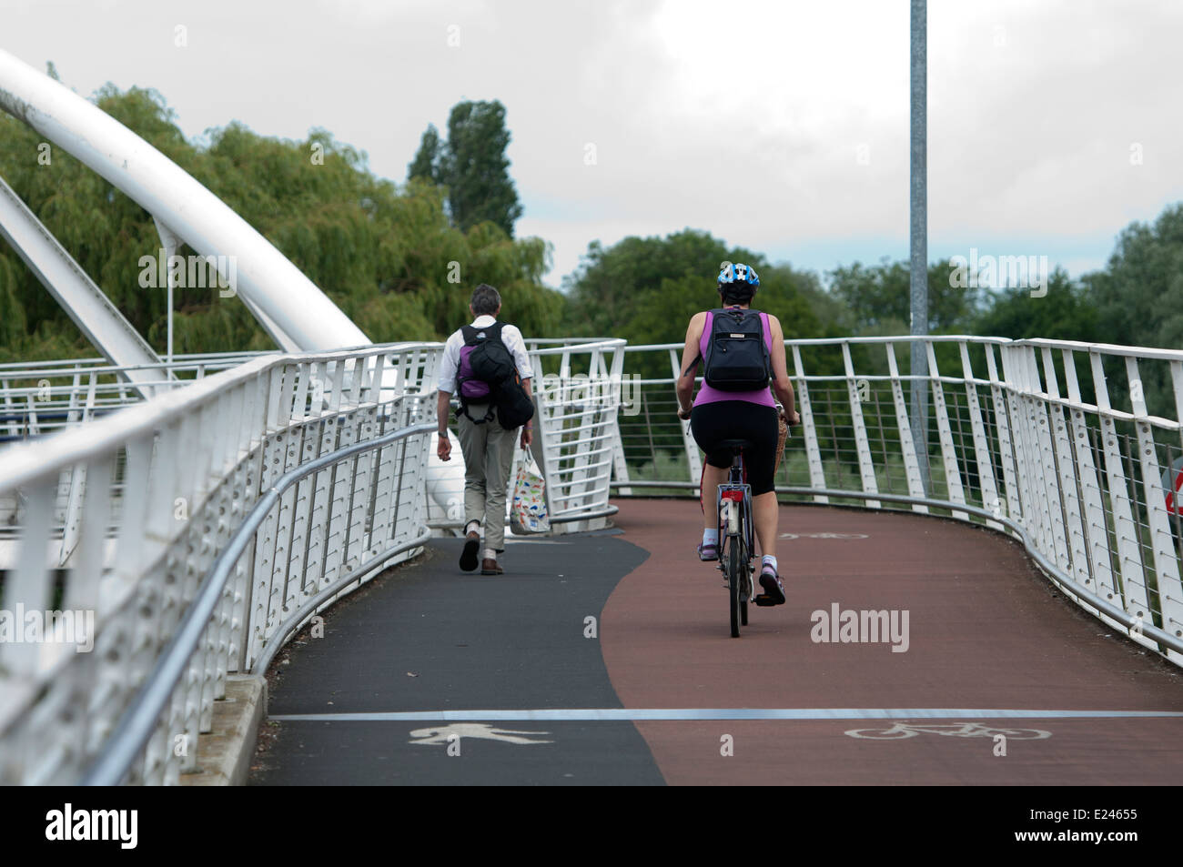 Cyclist and pedestrian on Riverside Bridge, Chesterton, Cambridge, UK Stock Photo