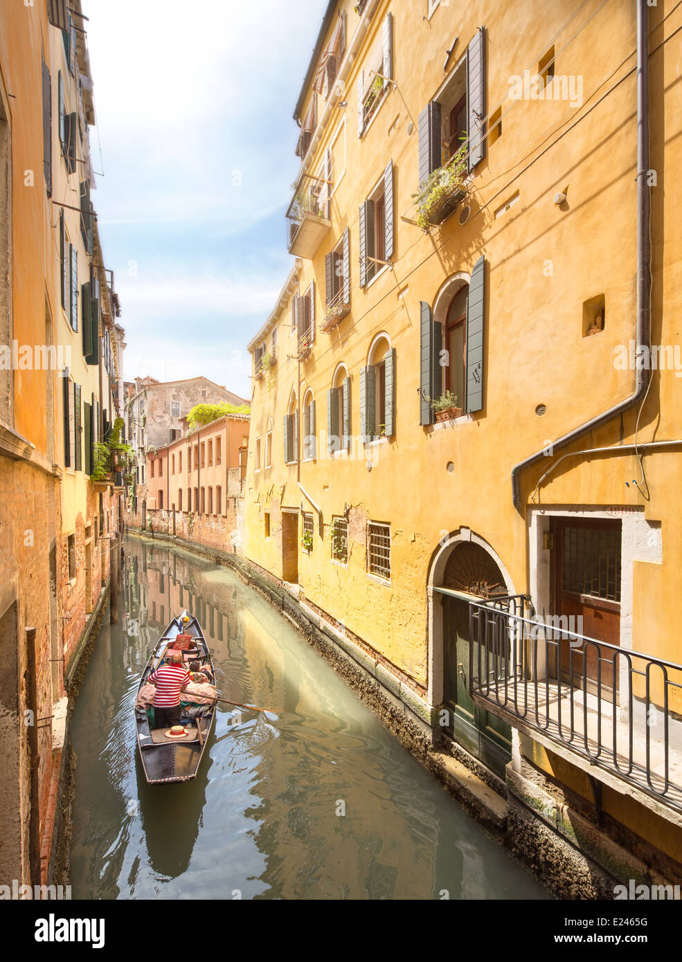 Gondola with gondolier in Venice channel, Italy Stock Photo - Alamy