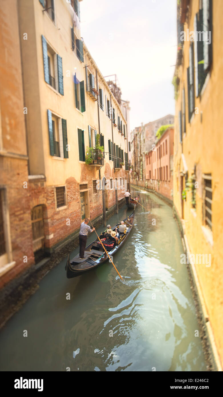 Gondola with gondolier in Venice channel, Italy Stock Photo - Alamy