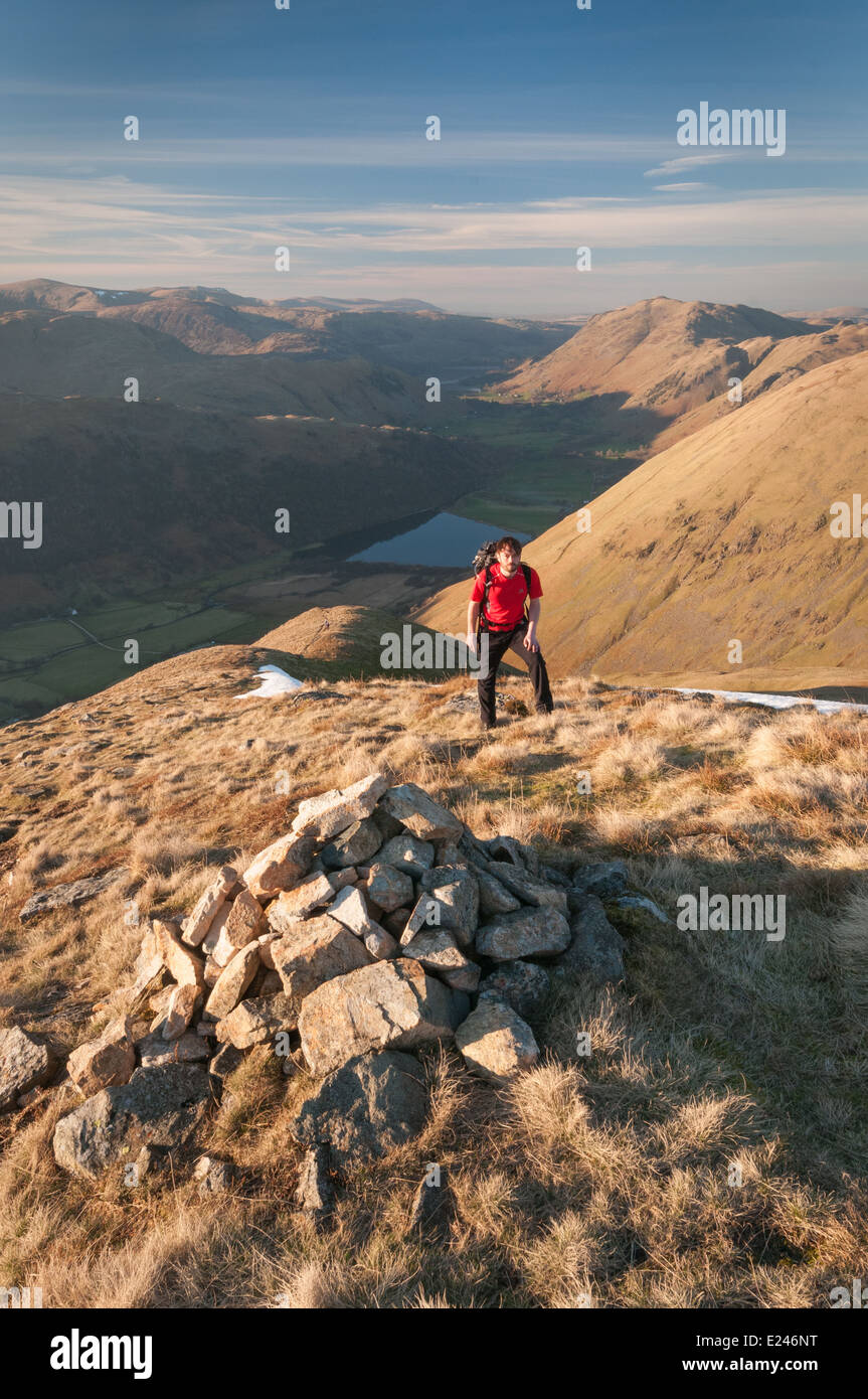 Walker on Caudale Moor, with Patterdale and Brothers Water in the background, English Lake District Stock Photo