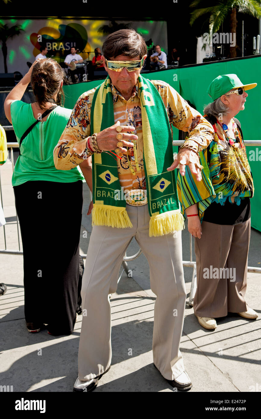 A stylish Elvis fan, dressed Brazilian style, dances during the Brazil Day celebrations in Trafalgar Square. Stock Photo