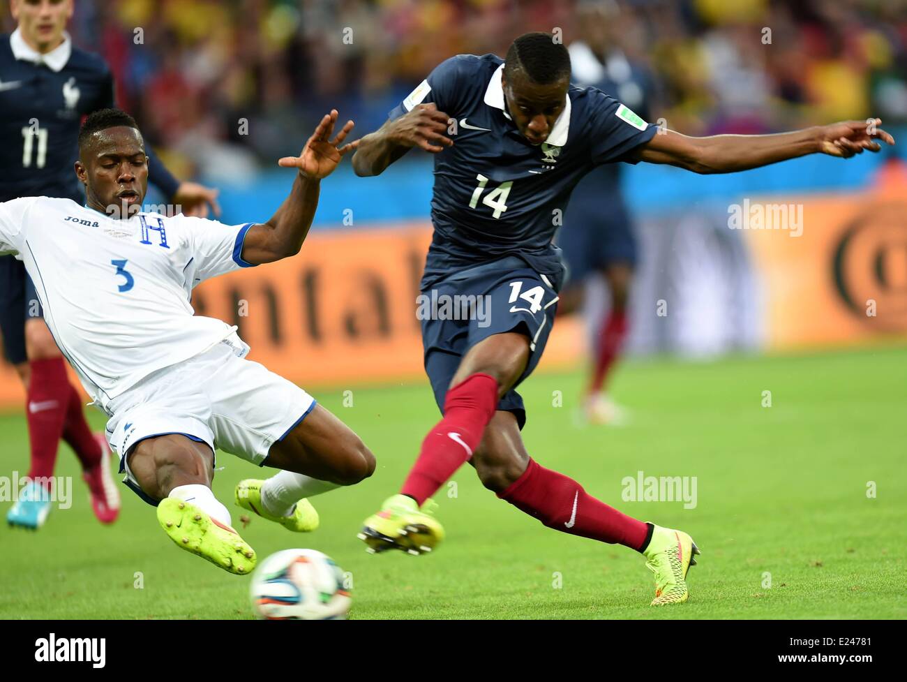 Porto Alegre, Brazil. 15th June, 2014. Frances Blaise Matuidi (R) challenges with Honduras Maynor Figueroa during a Group E match between France and Honduras of 2014 FIFA World Cup at the Estadio Beira-Rio Stadium in Porto Alegre, Brazil, June 15, 2014. (Xinhua/Li Ga)(pcy) (SP)BRAZIL-PORTO ALEGRE-WORLD CUP 2014-GROUP E-FRANCE VS HONDURAS Credit:  Action Plus Sports/Alamy Live News Stock Photo