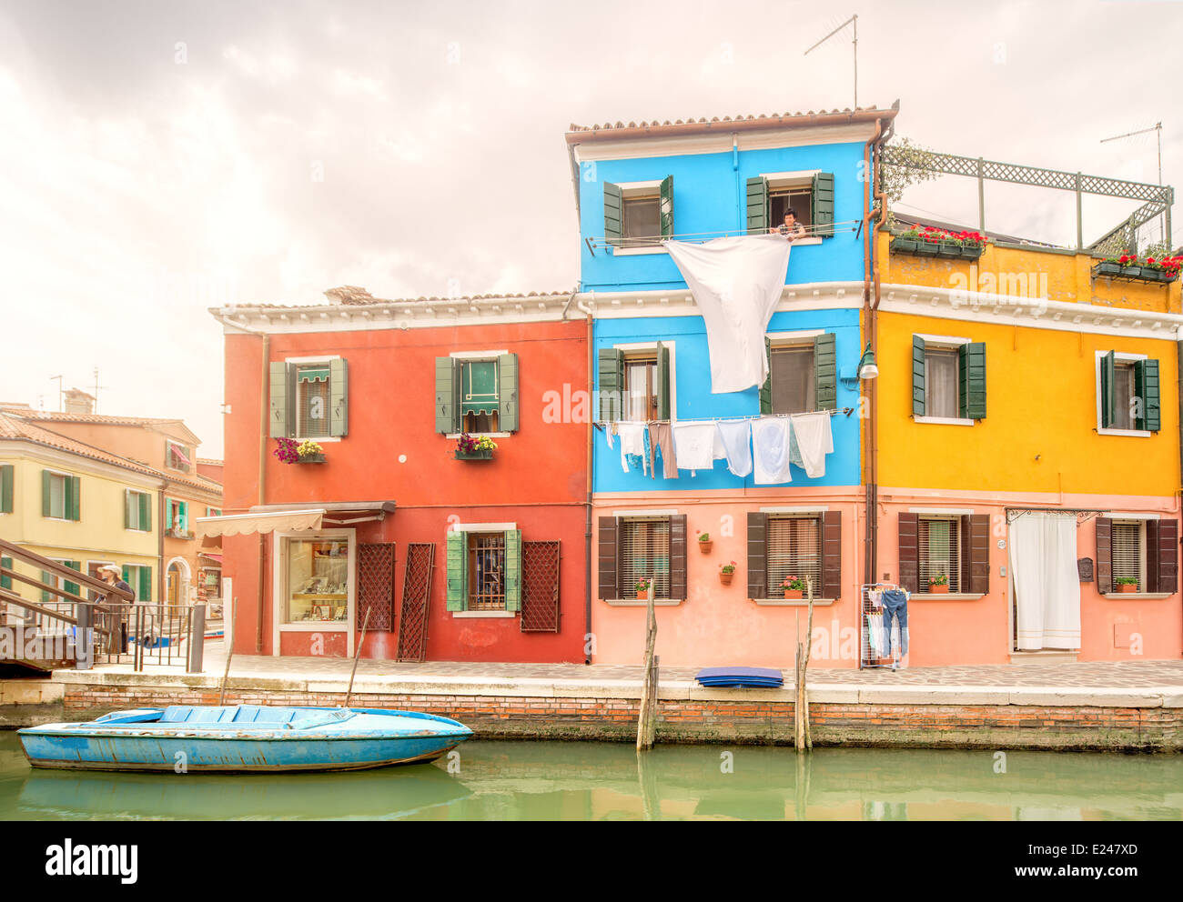 Murano and Burano island, street with glass store, beautiful colorfull houses, boats Stock Photo