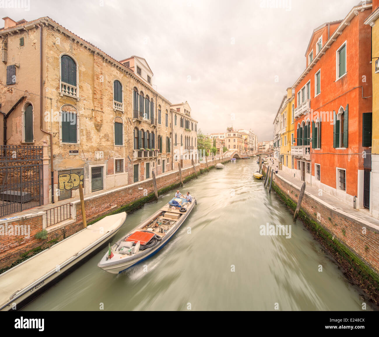 Gondola with gondolier in Venice channel, Italy Stock Photo - Alamy