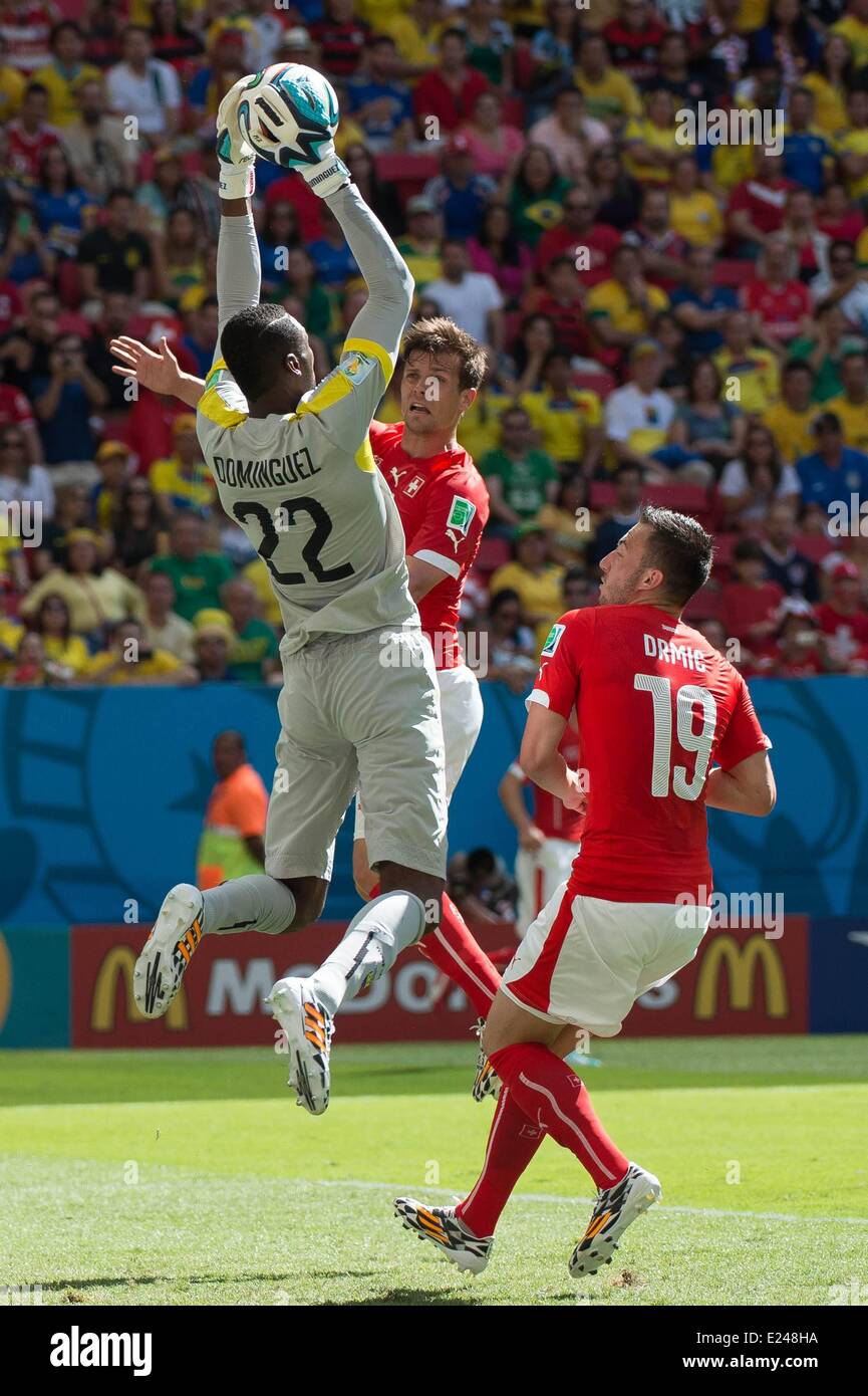 Brasilia, Brazil. 15th June, 2014. Valentin Stocker (SUI) and Josip Drmic (SUI) challenge keeper Alexander Dominguez (ECU) during a Group E match between Switzerland and Ecuador of 2014 FIFA World Cup at the Estadio Nacional Stadium in Brasilia, capital of Brazil, June 15, 2014. Switzerland won 2-1 over Ecuador on Sunday. Credit:  Action Plus Sports Images/Alamy Live News Stock Photo