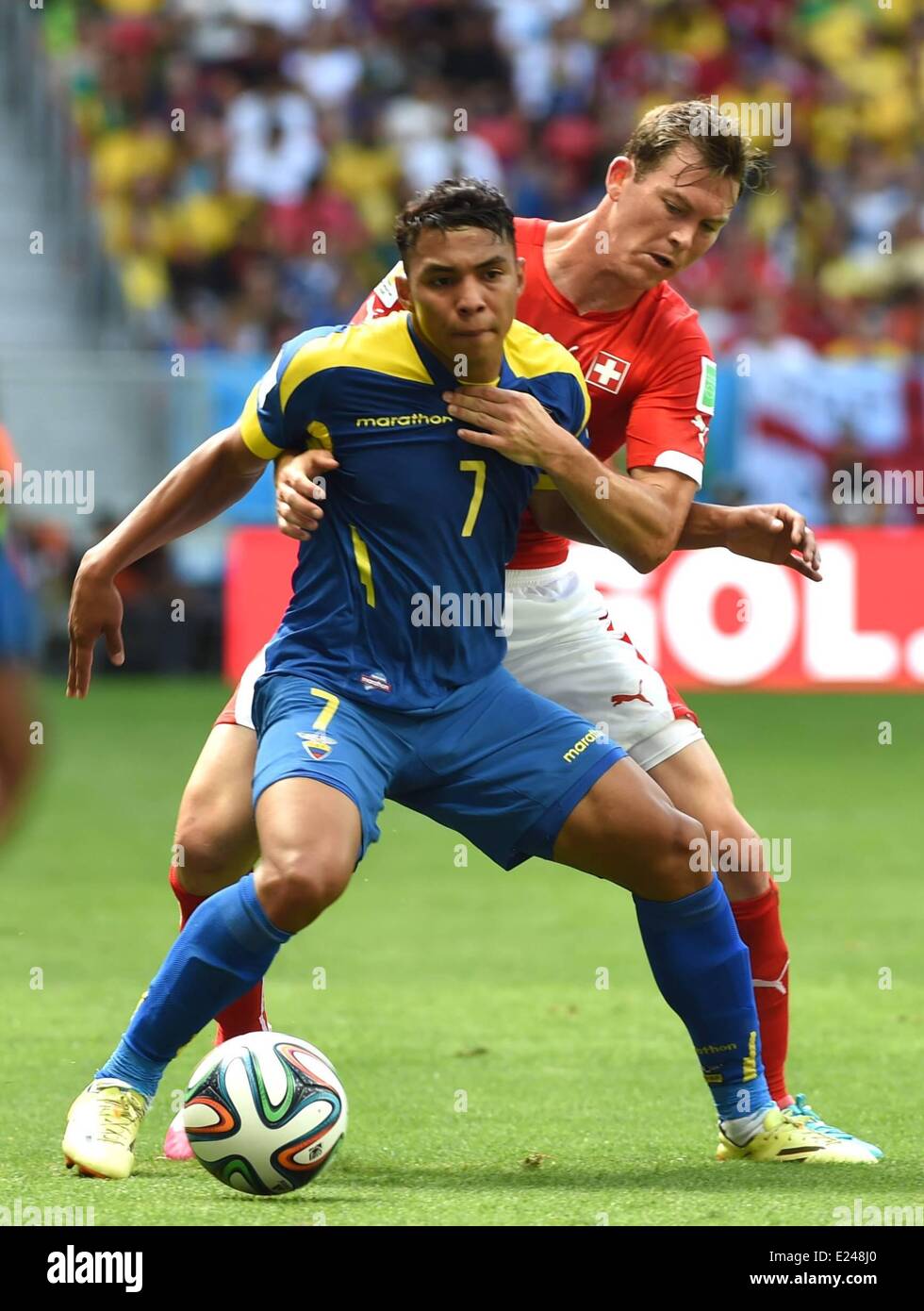 Brasilia, Brazil. 15th June, 2014. Swiss Stephan Lichtsteiner (back) defends against Ecuadors Jefferson Montero during a Group E match between Switzerland and Ecuador of 2014 FIFA World Cup at the Estadio Nacional Stadium in Brasilia, capital of Brazil, June 15, 2014. Credit:  Action Plus Sports Images/Alamy Live News Stock Photo