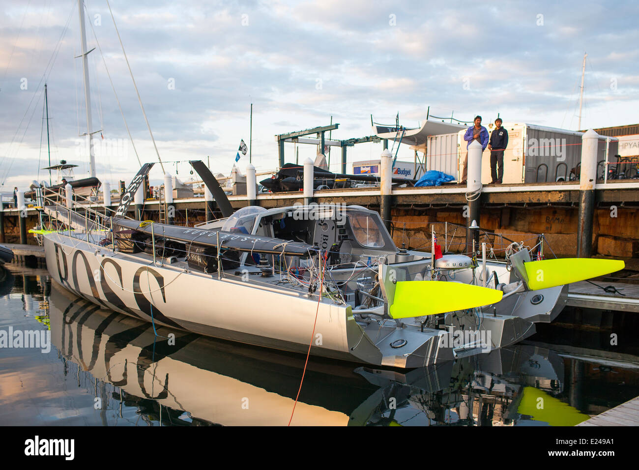 Hugo Boss, an IMOCA 60 short handed racing boat designed to sail in ocean  racing on the dock at Newport Shipyard awaits repairs Stock Photo - Alamy