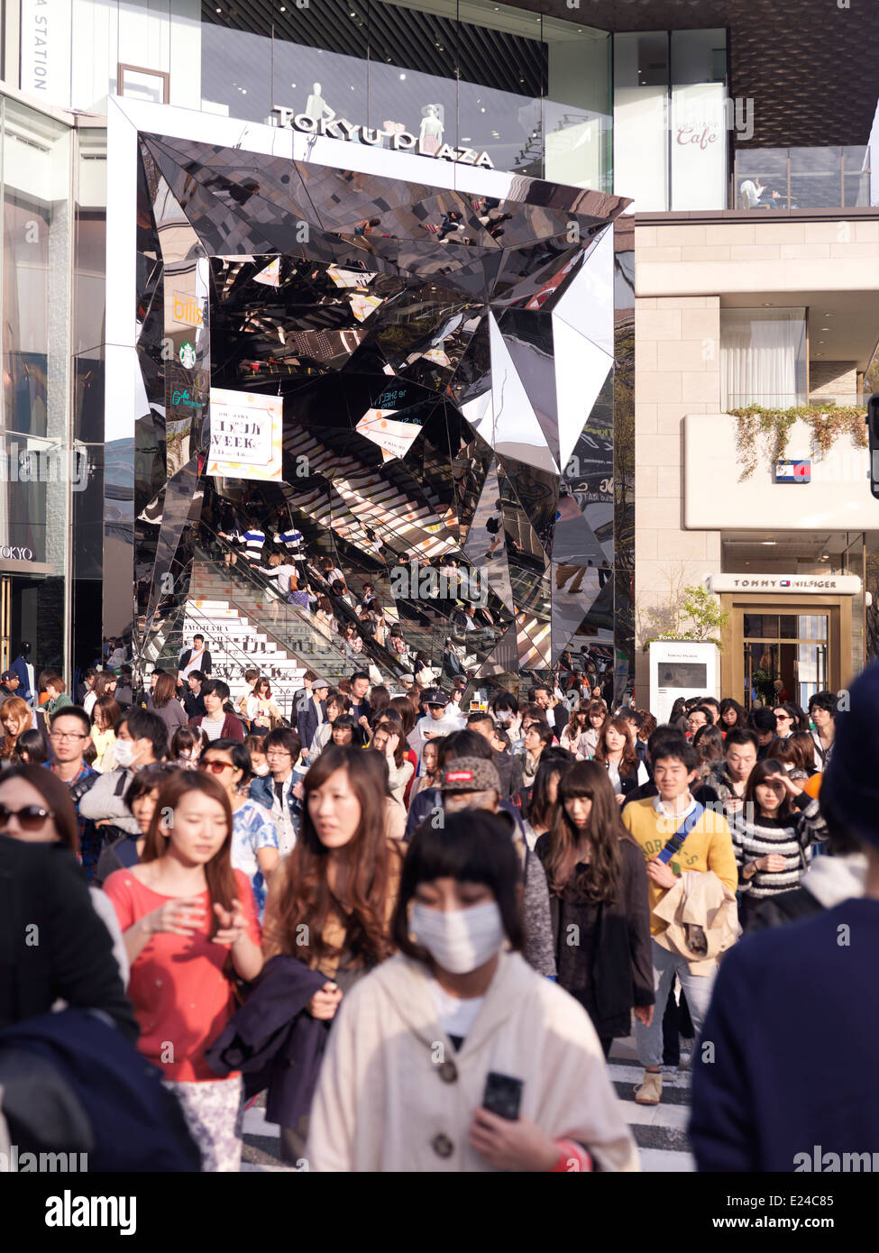 Young people exiting Tokyu Plaza Omotesando Harajuku shopping center in Tokyo, Japan. Stock Photo