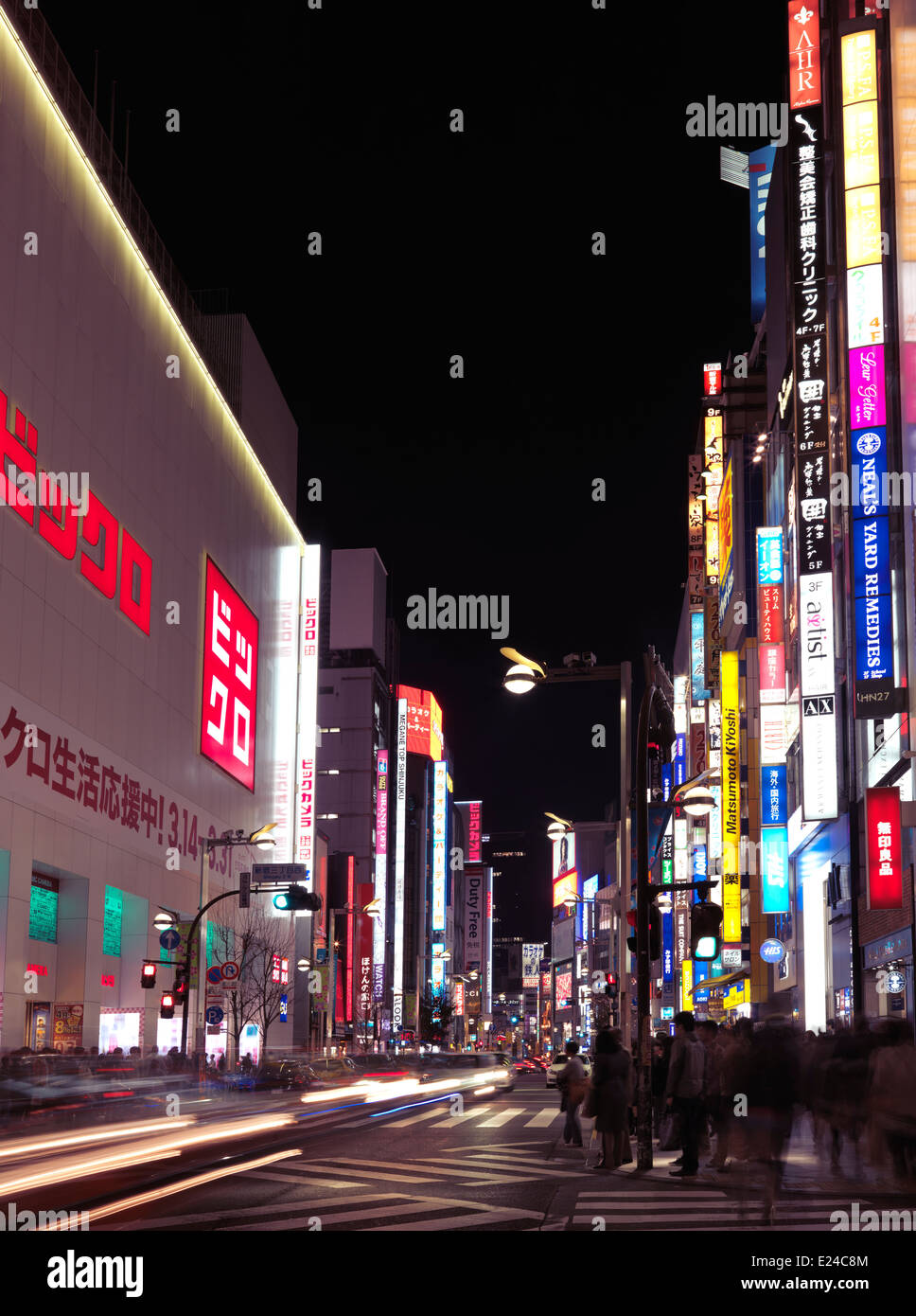 Uniqlo store on Shinjuku dori street. Tokyo nighttime city scenery. Shinjuku, Tokyo, Japan 2014. Stock Photo