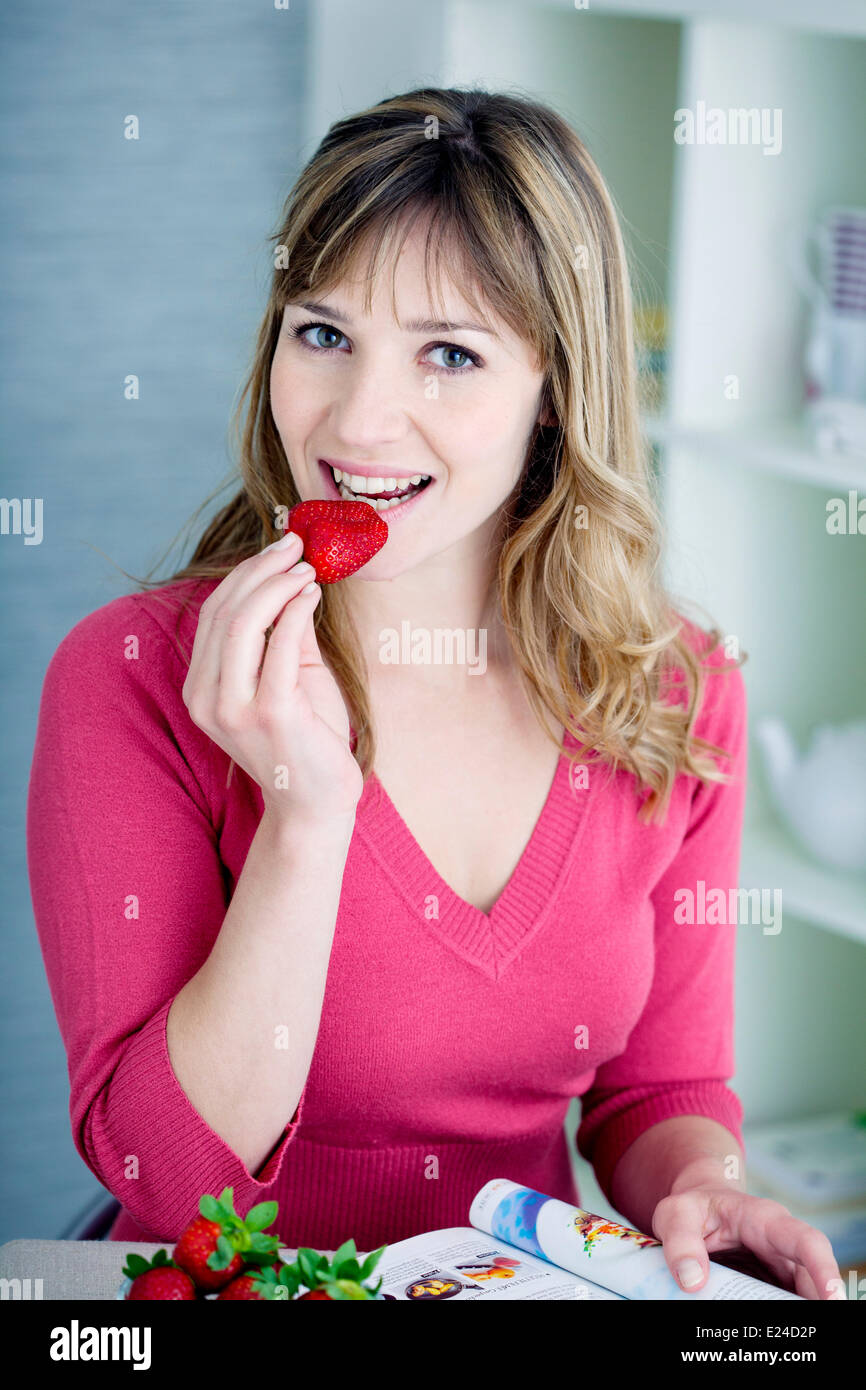 Woman eating fruit Stock Photo
