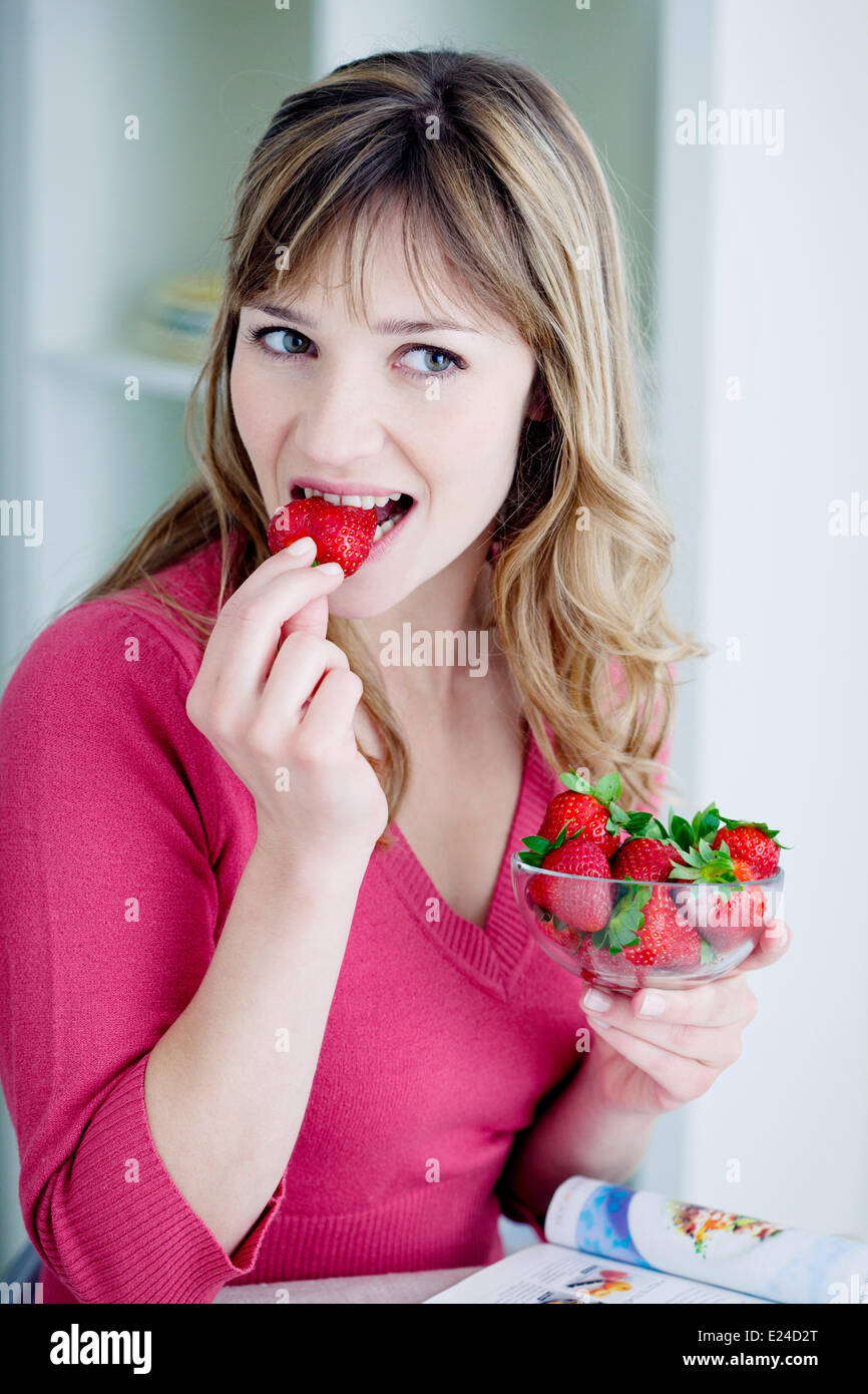 Woman eating fruit Stock Photo