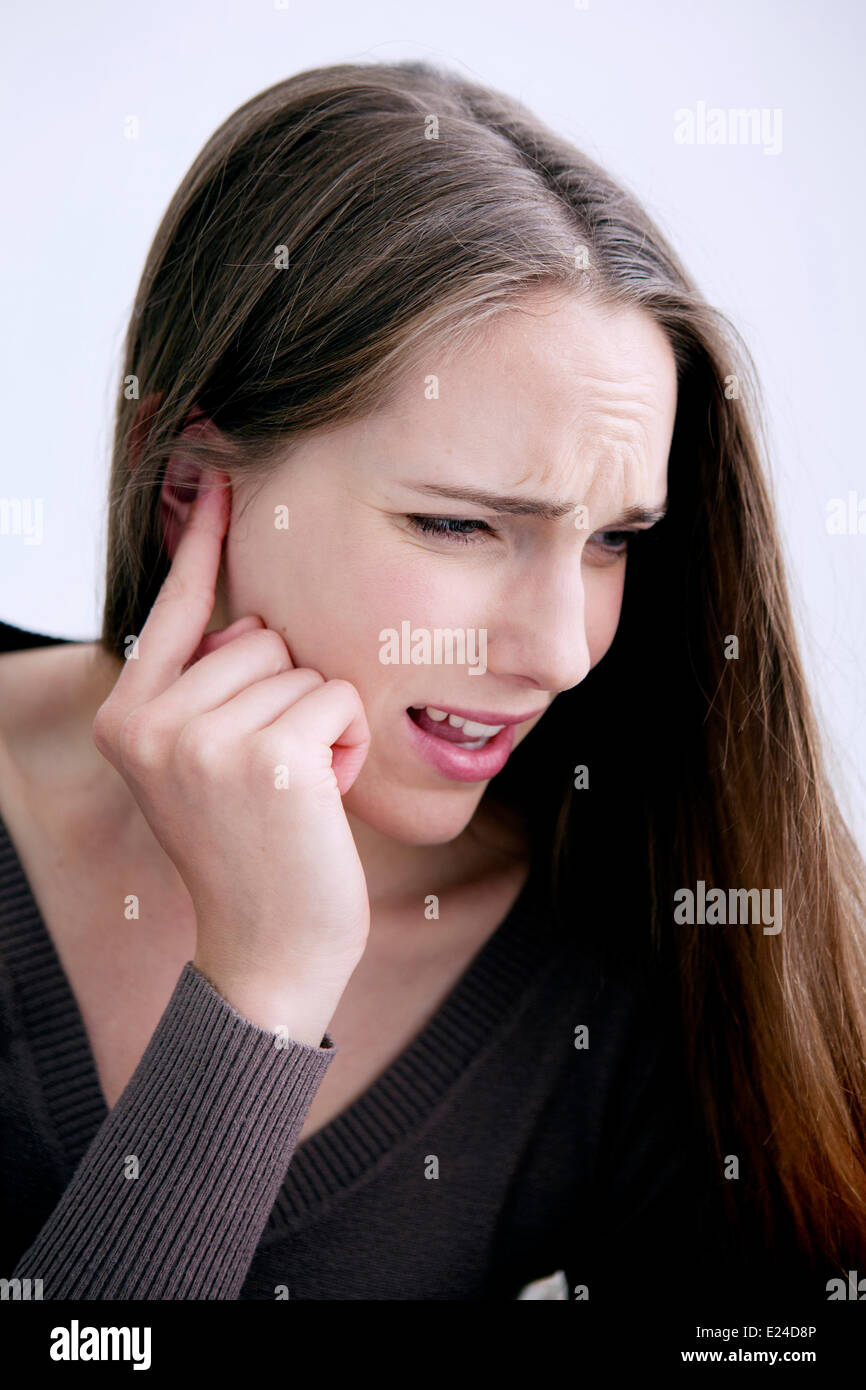 Ear pain in a woman Stock Photo