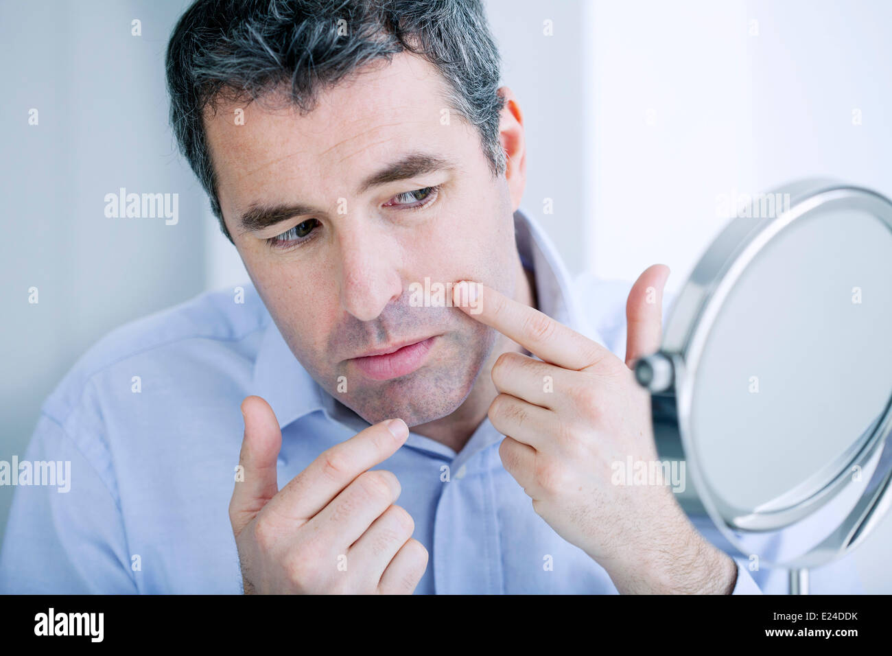 Man with mirror Stock Photo