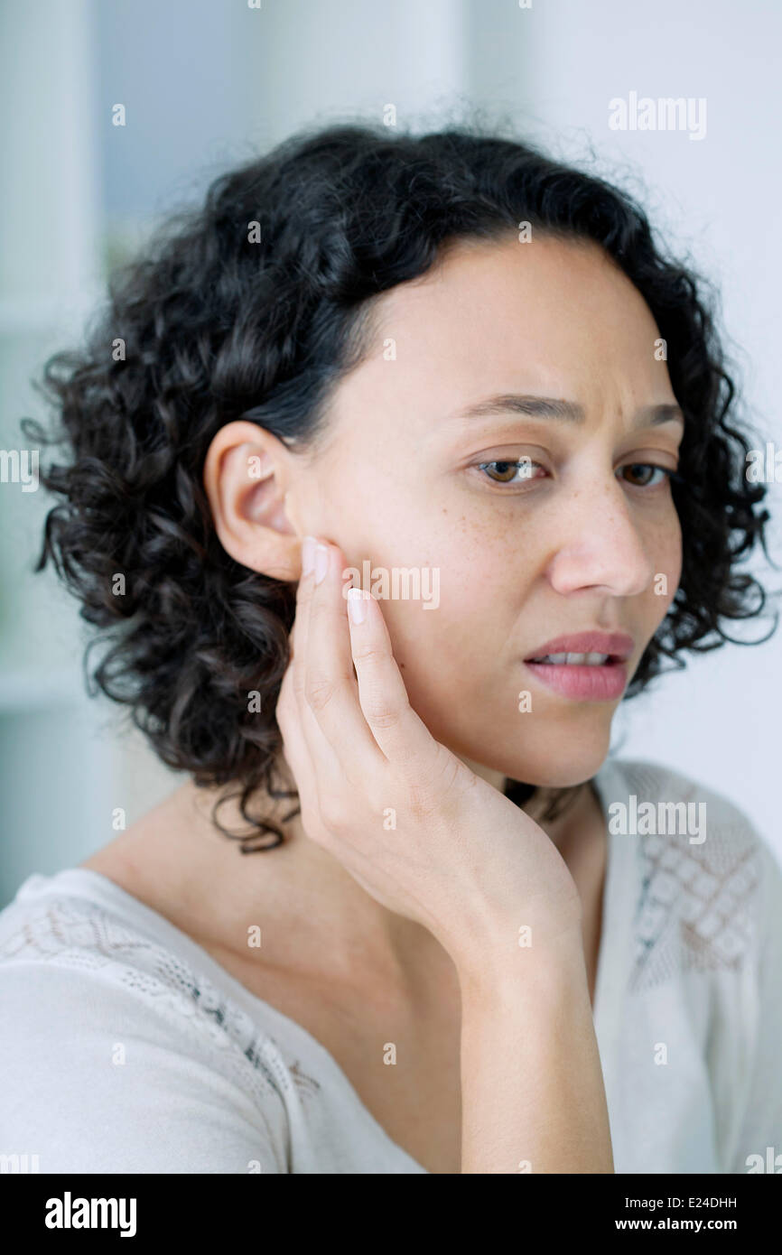 Ear pain in a woman Stock Photo