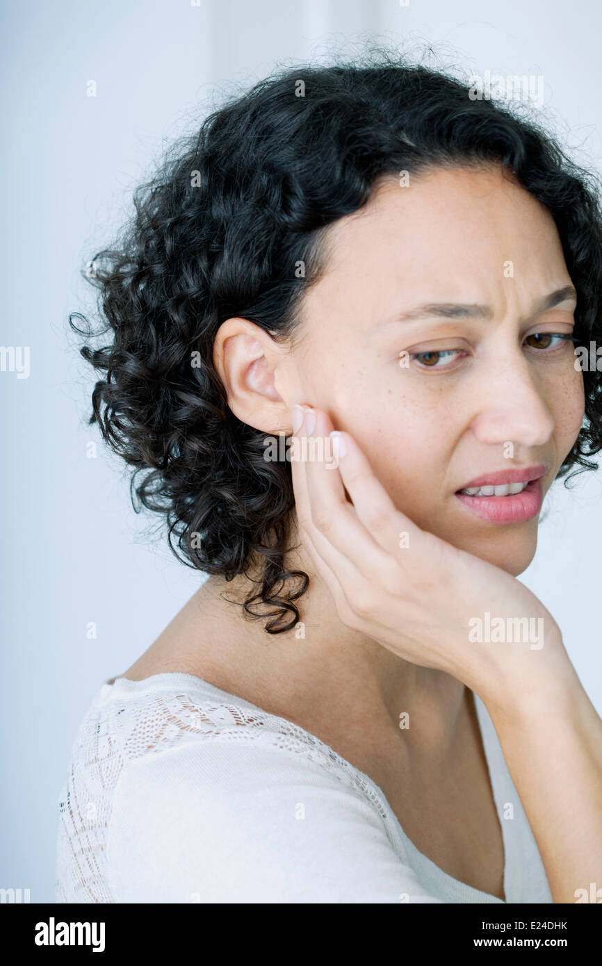 Ear pain in a woman Stock Photo