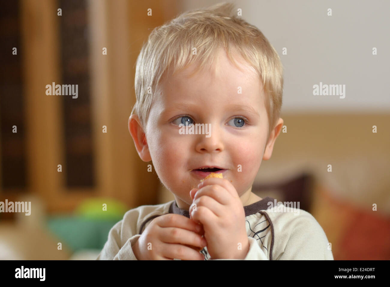 Child with a biscuit. Stock Photo