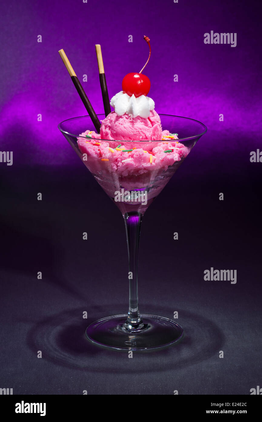 Raspberry ice cream in a Martini glass with with decoration Stock Photo