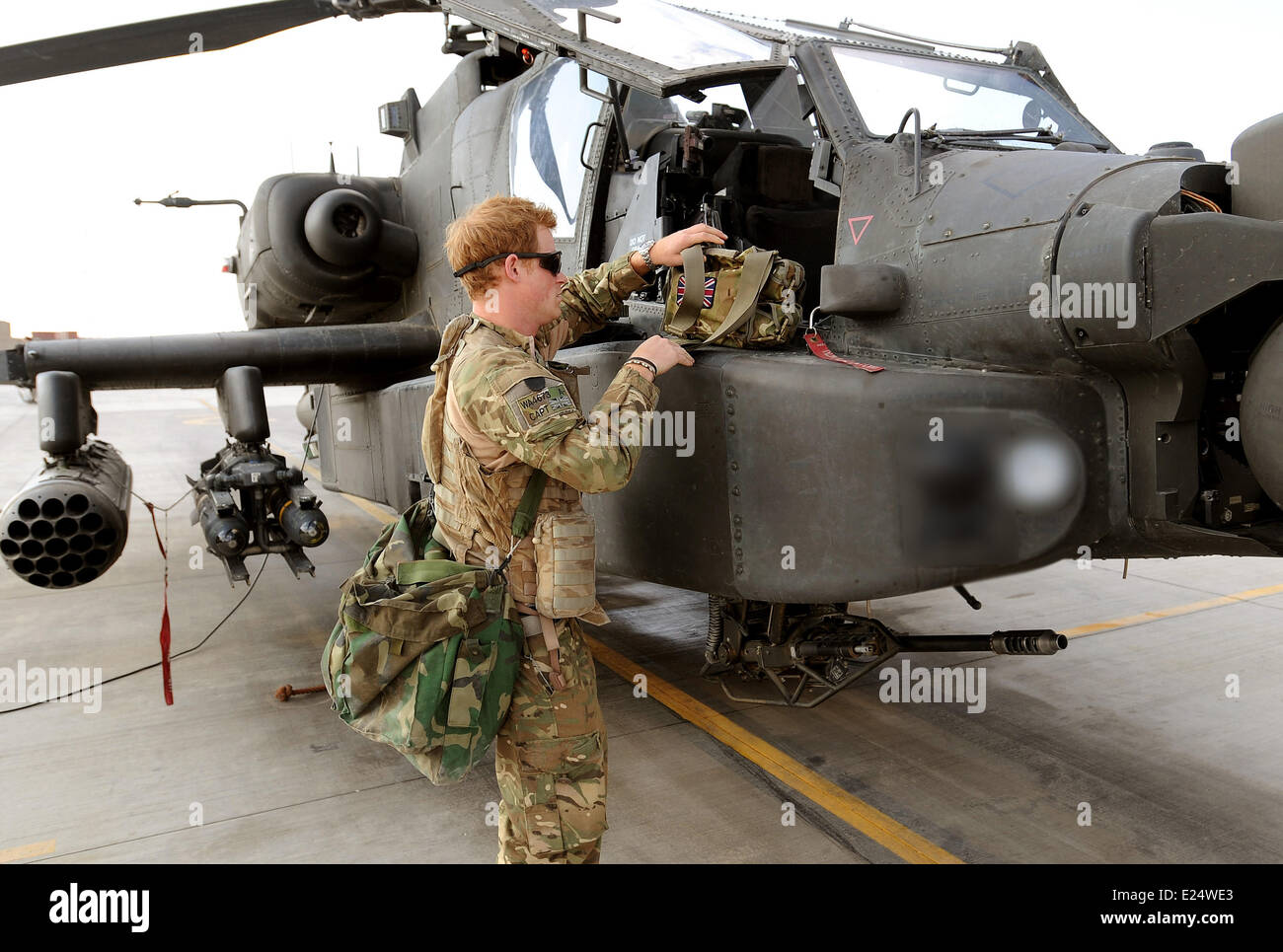 Previously unissued picture dated 31/10/2012 of Prince Harry or just plain Captain Wales as he is known in the British Army, at the British controlled flight-line in Camp Bastion southern Afghanistan, where he is serving as an Apache Helicopter Pilot/Gunner with 662 Sqd Army Air Corps, from September 2012 for four months until January 2013.  Where: Helmand, Afghanistan When: 31 Oct 2012 Stock Photo
