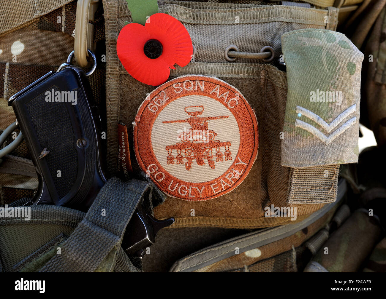 Previously unissued picture dated 01/11/2012 of Cpl Graham Carr arming loading point commander (ALPC) of 662 Squadron, 3 Reg Army Air Corps, with his weapon, poppy, and badge on his body armour, at Camp Bastion in Afghanistan.  Where: Helmand, Afghanistan When: 01 Nov 2012 Stock Photo