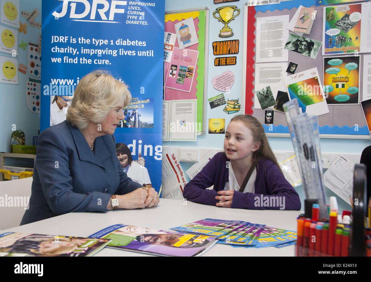 Camilla, Duchess of Cornwall, meets diabetes patients and their families in the University College Hospital Inpatient Adolescent Ward and tours the ward's school room and games room before attending a reception with staff and JDRF supporters at The University College Hospital. Camilla, who is President of the JDRF type 1 diabetes charity, plays pool with a young patient at the unit and War Horse actor Jeremy Irvine, who suffers from the condition  Featuring: Camilla,Duchess of Cornwall Where: London, Royaume Uni When: 31 Jan 2013 Stock Photo