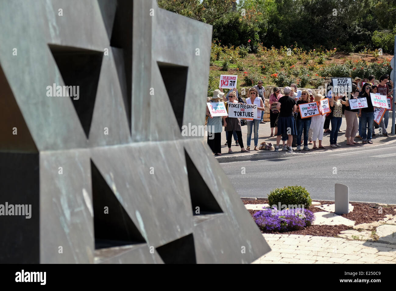 Jerusalem, Israel. 16th June, 2014. Physicians for Human Rights (PHR Israel) stage a demonstration opposite the Knesset protesting government backed legislation underway to allow rapid force feeding of hunger striking Palestinians prisoners. PHR claim some 80 prisoners are hospitalized handcuffed to their beds in Israeli hospitals after more than 50 days of a hunger strike. Credit:  Nir Alon/Alamy Live News Stock Photo