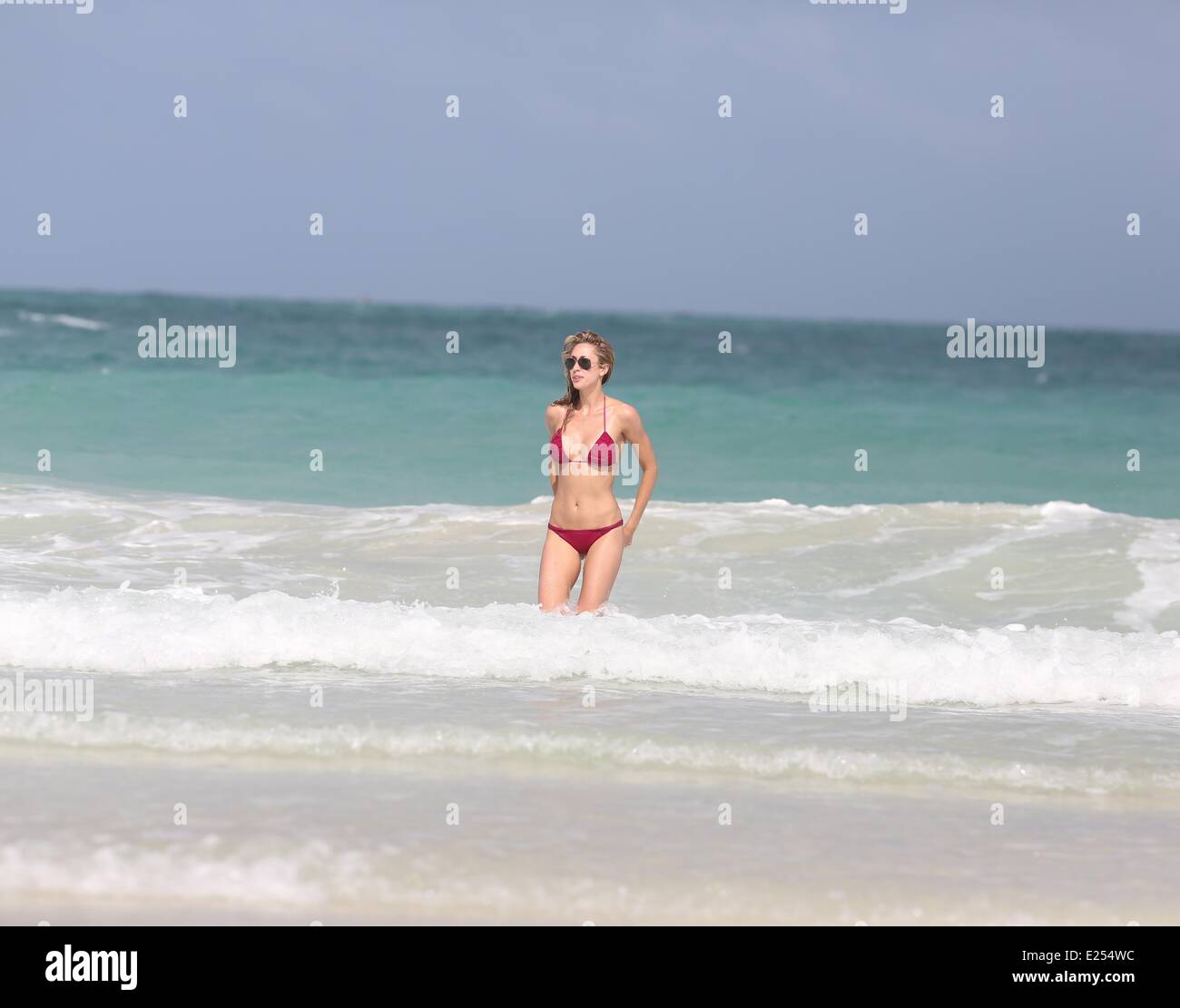 Lauren Stoner enjoys a day on Miami beach in a skimpy purple bikini  Where: Miami, Florida, United States When: 10 Jul 2013 Cred Stock Photo