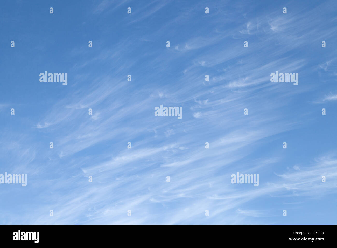 Cirrus clouds against a blue sky in summer, Dorset, UK Stock Photo