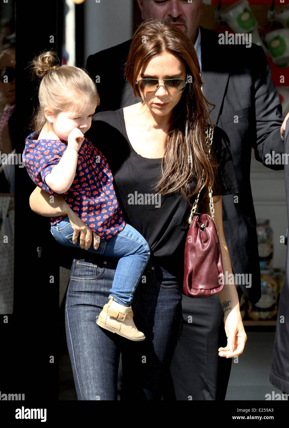 Victoria Beckham And Her Daughter Harper Outside The Bonton Store In Paris Featuring Victoria 