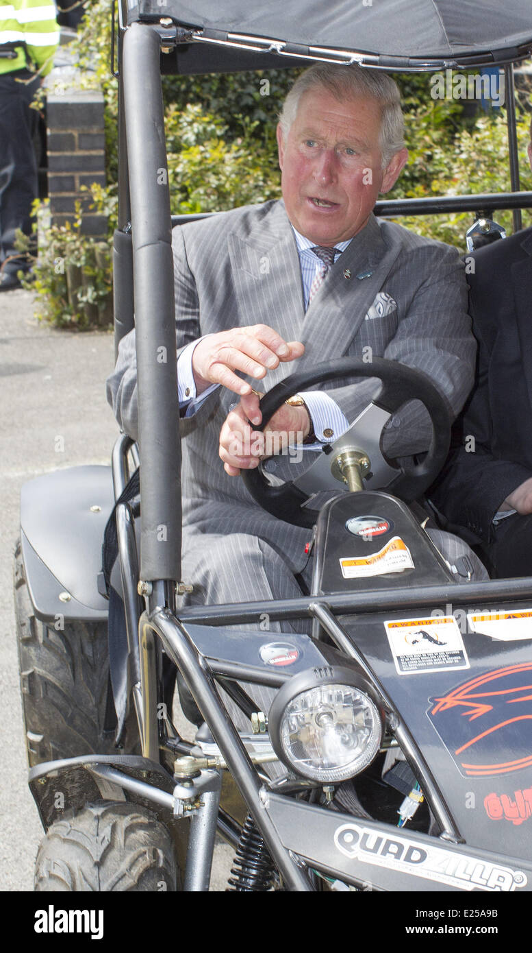 Britain's Prince Charles, HRH The Prince of Wales,   gets into and goes for a drive in a buggy with buggy builder Harley Barker during a visit the Wedgwood Institute where he met local artists who make up Burslem's 'Creative Quarter', viewed Swan Square and then toured Swan Bank Church, Burslem  Featuring: Prince Charles,HRH The Prince of Wales Where: Stoke on Trent, United Kingdom When: 16 May 2013 Stock Photo