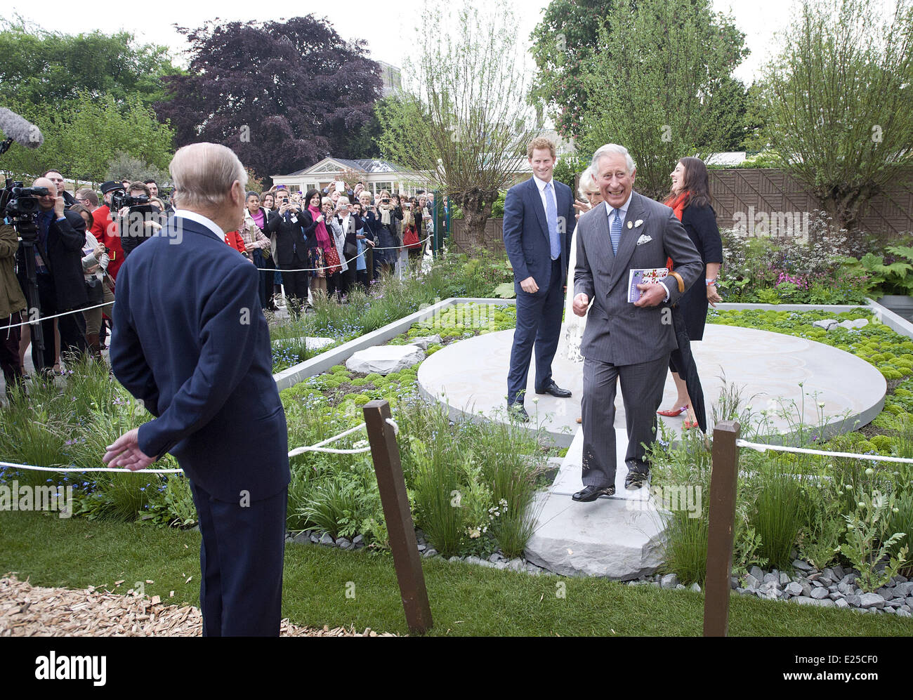 LONDON - UK - 20 MAY 2013: ROTA: Chelsea Flower Show 2013. Members of the Royal Family join HM Queen Elizabeth for a walk around the annual Chelsea Flower Show.  Prince Harry show his garden to his father Prince Charles Royal Rota photograph by Geoff Pugh/Supplied by Ian Jones Photography. NO Uk Sales for 28 days until 18-6-2013  Featuring: Charles,Prince of Wales,Prince Charles,Prince Harry,Prince Philip,Duke of Edinburgh Where: London, United Kingdom When: 20 May 2013 Stock Photo