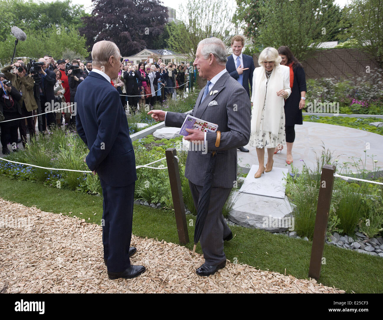 LONDON - UK - 20 MAY 2013: ROTA: Chelsea Flower Show 2013. Members of the Royal Family join HM Queen Elizabeth for a walk around the annual Chelsea Flower Show.  Prince Harry show his garden to his father Prince Charles Royal Rota photograph by Geoff Pugh/Supplied by Ian Jones Photography. NO Uk Sales for 28 days until 18-6-2013  Featuring: Camilla,Duchess of Cornwall,Charles,Prince of Wales,Prince Charles,Prince Harry,Prince Philip,Duke of Edinburgh Where: London, United Kingdom When: 20 May 2013 Stock Photo