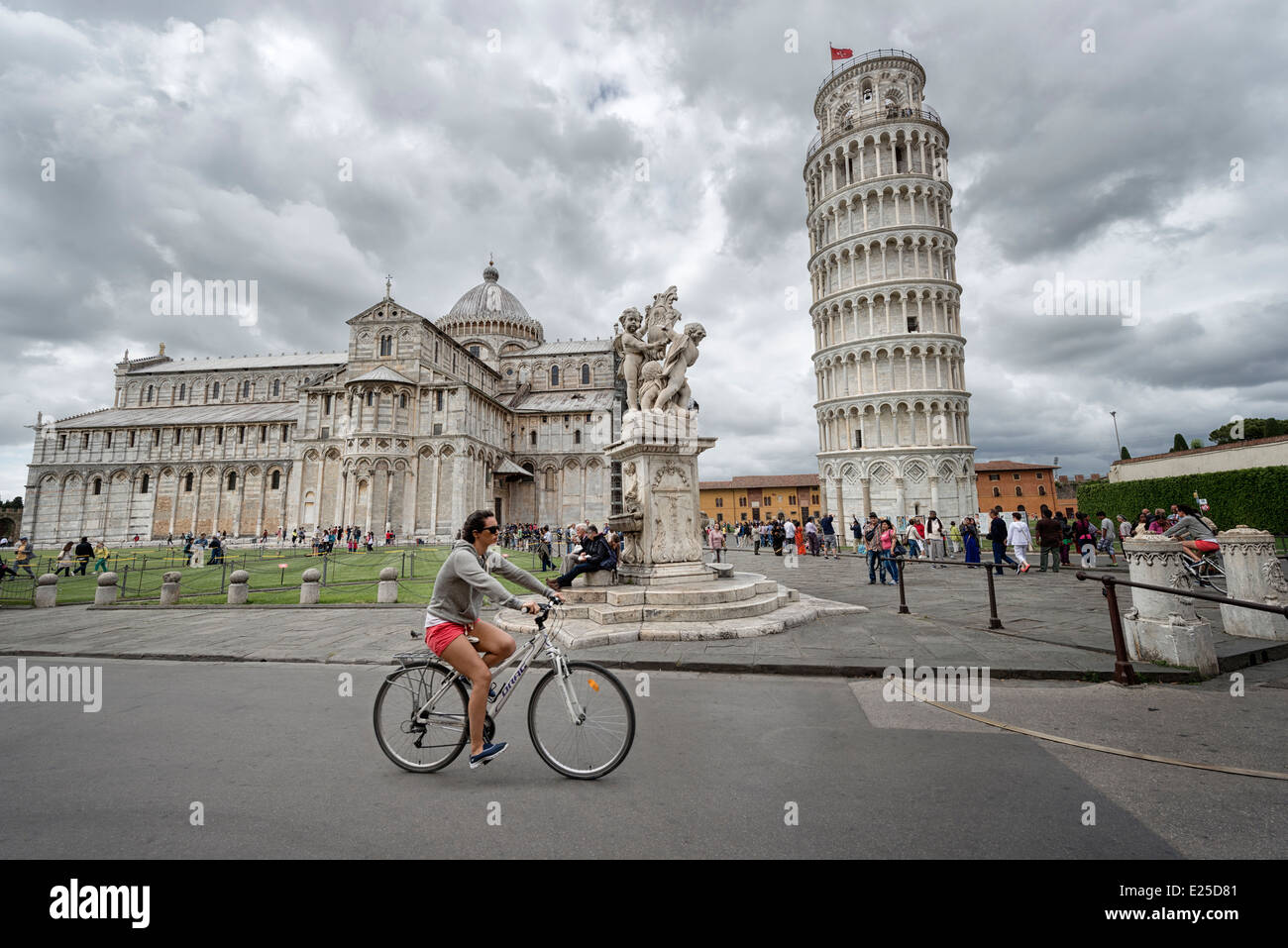 Cycling through  Piazza dei Miracoli (Square of Miracles) in Pisa Stock Photo
