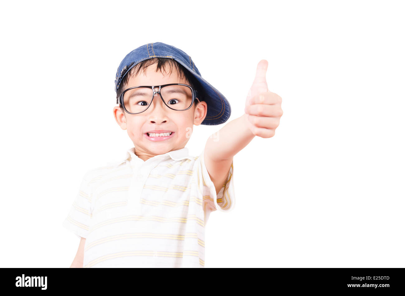 Joyful little boy holding his thumb up Stock Photo - Alamy