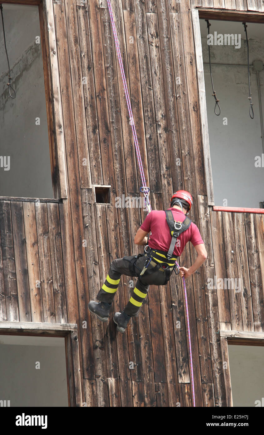 brave fireman climber expert you haul in the wall of the House