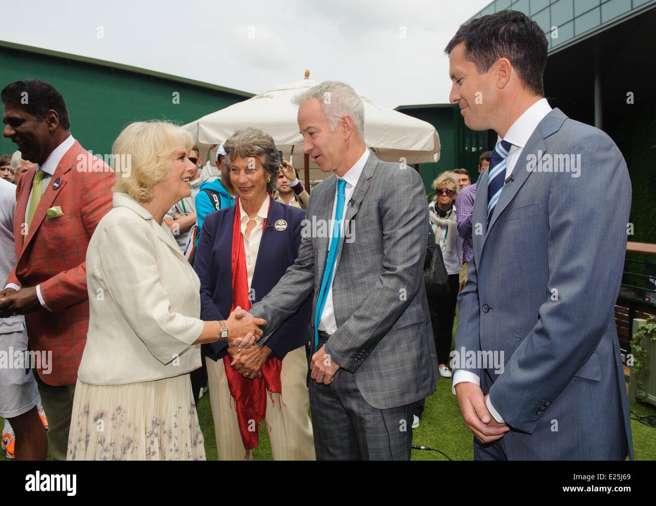 Britain's Camilla, The Duchess of Cornwall (left) meets (from left to right) former tennis players Virginia Wade, John McEnroe and Tim Henman during a visit to the Wimbledon Tennis Championships at the All England Lawn Tennis and Croquet Club, Wimbledon. Photo by Dominic Lipinski/PA/Royal Rota- Suppled by Ian Jones Photography  Featuring: Camilla,Duchess of Cornwall,Virginia Wade,John McEnroe,Tim Henman Where: London, United Kingdom When: 27 Jun 2013 Stock Photo