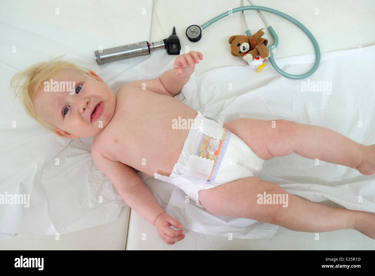 A crying baby at a routine visit at the doctor Stock Photo