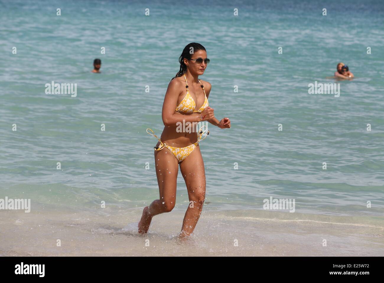 Emmanuelle Chriqui Rocked A Yellow String Bikini As She And Boyfriend Adrian Bellani Hit The