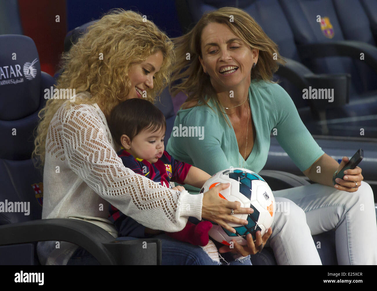 Shakira, along with her baby son and mother-in-law, watch her partner Gerard Pique in an FC Barcelona football match against Sevilla FC  Featuring: Shakira,Milan Pique Mebarak,Montserrat Bernabeu Where: Barcelona, Spain When: 14 Sep 2013 Stock Photo