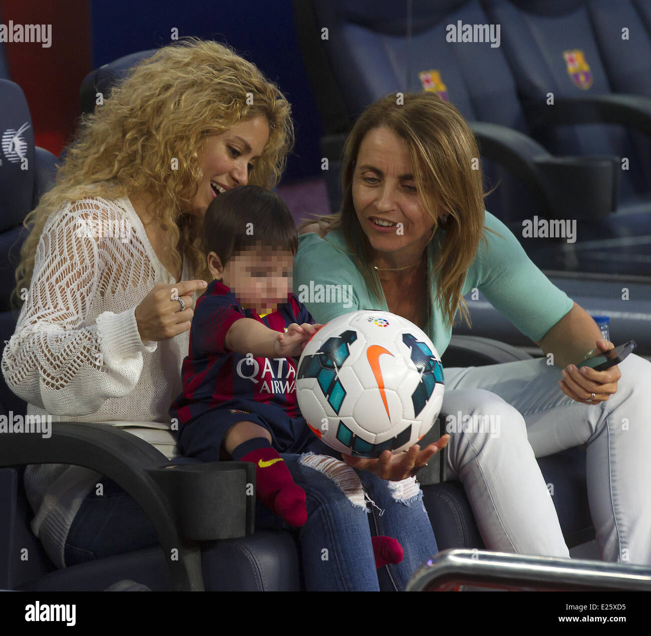 Shakira, along with her baby son and mother-in-law, watch her partner Gerard Pique in an FC Barcelona football match against Sevilla FC  Featuring: Shakira,Milan Pique Mebarak,Montserrat Bernabeu Where: Barcelona, Spain When: 14 Sep 2013 Stock Photo