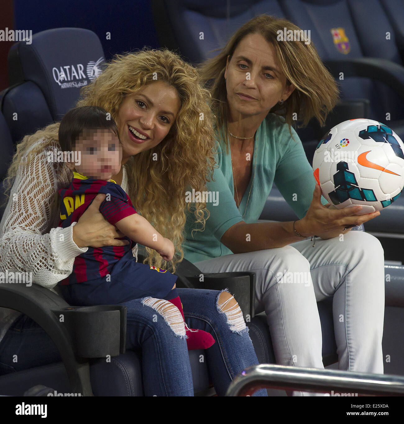 Shakira, along with her baby son and mother-in-law, watch her partner Gerard Pique in an FC Barcelona football match against Sevilla FC  Featuring: Shakira,Milan Pique Mebarak,Montserrat Bernabeu Where: Barcelona, Spain When: 14 Sep 2013 Stock Photo