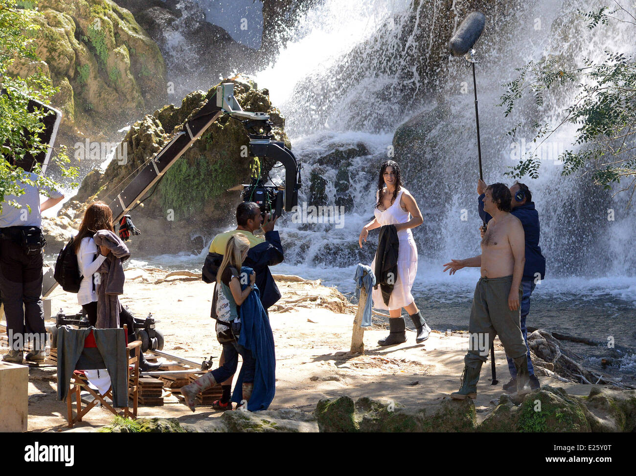 Emir Kusturica and Monica Bellucci filmming 'The Milky Way' movie, at Kravica falls on the Trebizat. Kusturica is a writer, director and actor, and the attractive Italian actress Monica Bellucci, otherwise the director's close friend, plays a role of a Serb woman who was raped by members of the Army of Bosnia and Herzegovina  Featuring: Emir Kusturica,Monica Bellucci Where: Ljubuski, Bosnia and Herzegovina When: 21 Sep 2013 Stock Photo