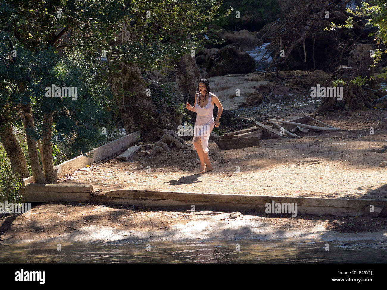 Emir Kusturica and Monica Bellucci filmming 'The Milky Way' movie, at Kravica falls on the Trebizat. Kusturica is a writer, director and actor, and the attractive Italian actress Monica Bellucci, otherwise the director's close friend, plays a role of a Serb woman who was raped by members of the Army of Bosnia and Herzegovina  Featuring: Emir Kusturica,Monica Bellucci Where: Ljubuski, Bosnia and Herzegovina When: 21 Sep 2013 Stock Photo