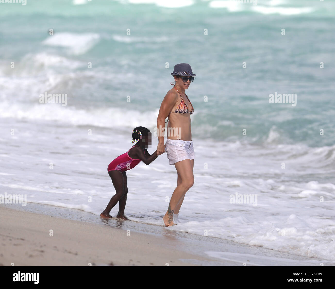 Jillian Michaels and her daughter, Lukensia enjoy the surf on Miami Beach  during Veteren's Day Featuring