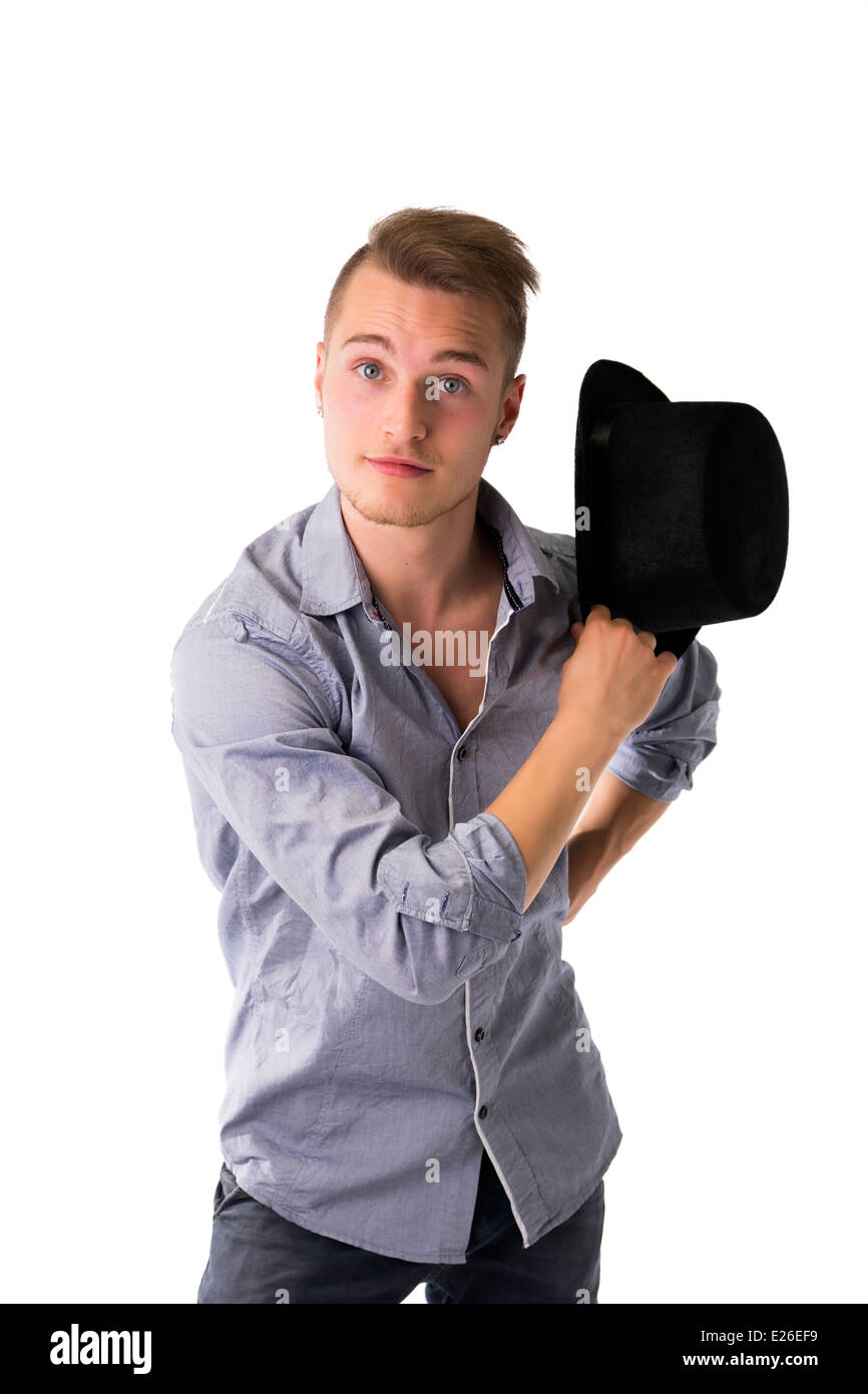 Handsome, cool, confident young man with top hat in hand, looking at camera Stock Photo